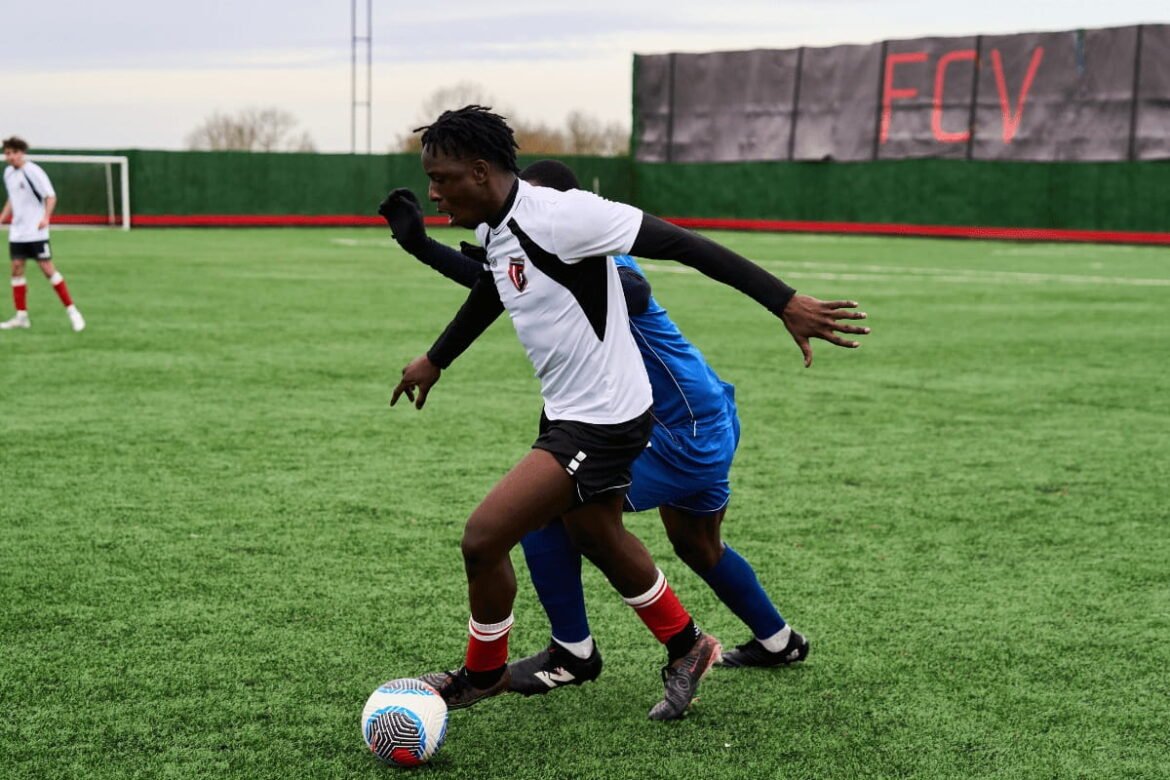 Young footballers training at a football academy in Lagos Nigeria during a professional coaching session.